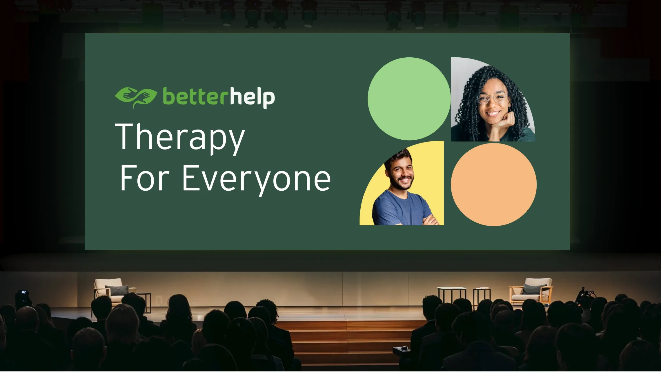 “Therapy for Everyone” BetterHelp presentation on a large screen in front of an audience