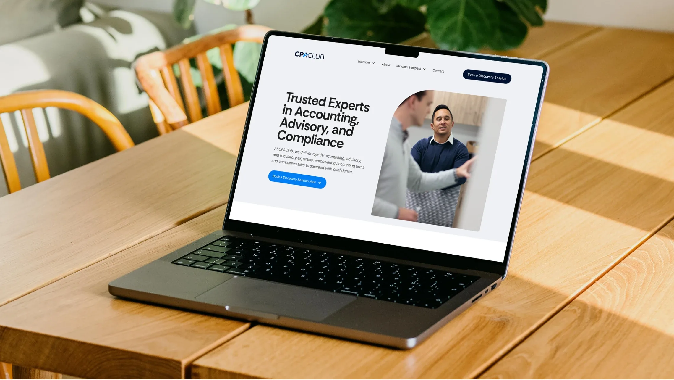 CPA Club website homepage, “Trusted experts in accounting, advisory and compliance”, on a laptop