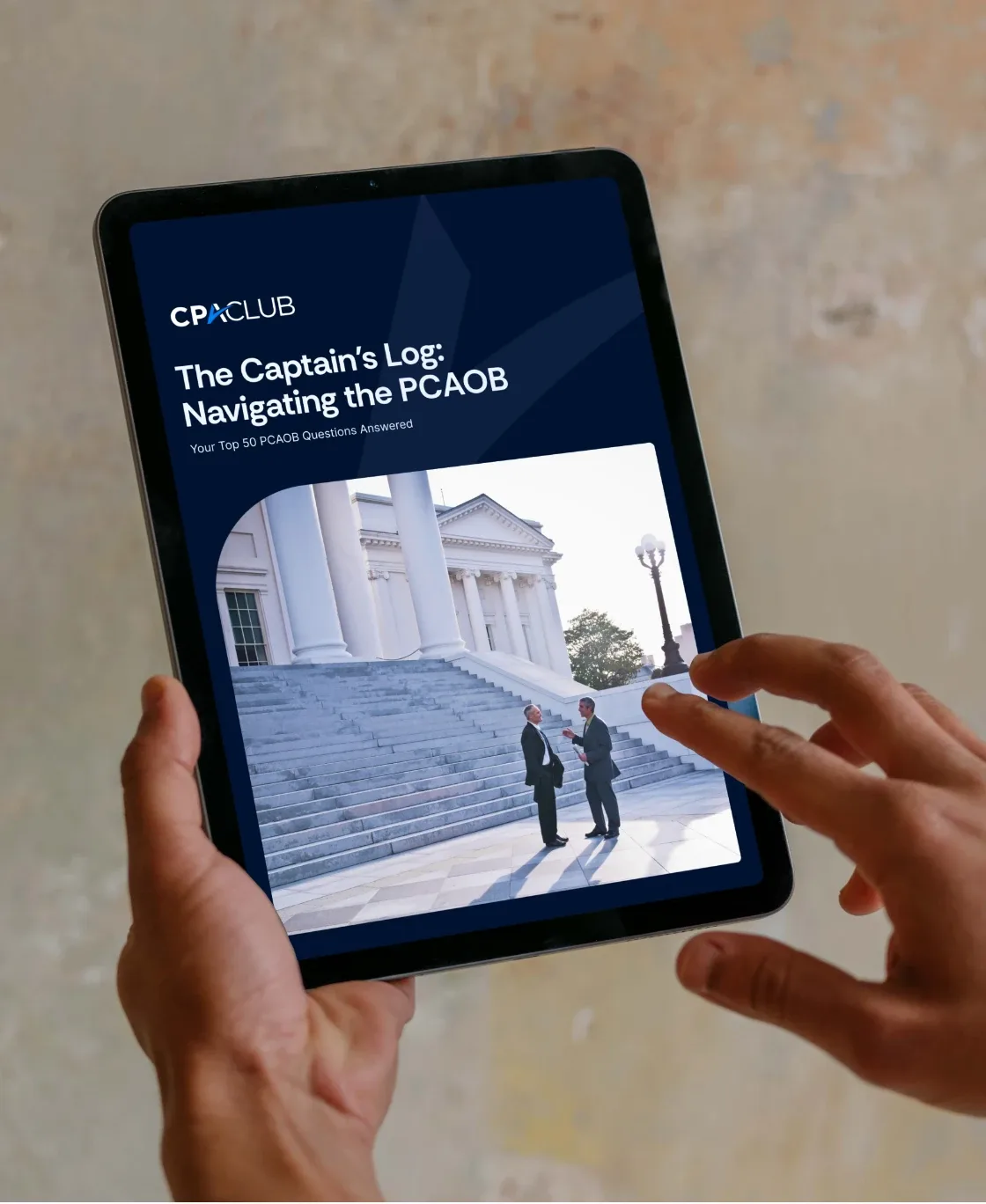 Hands holding a tablet showing the CPA Club article “The Captain’s Log: Navigating the PCAOB”