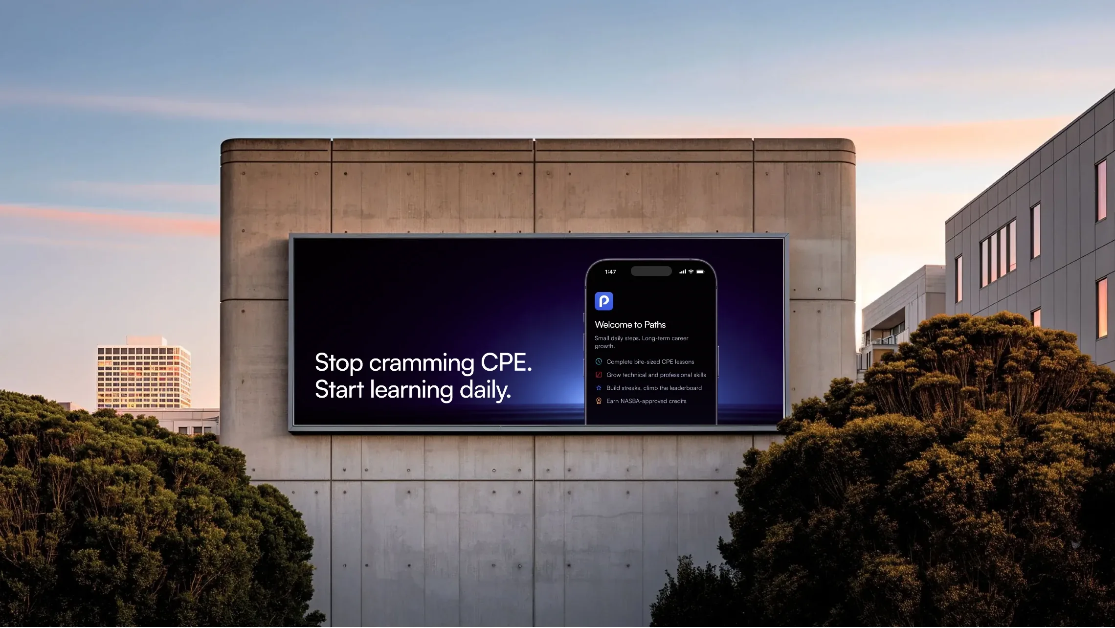 Billboard on a concrete building: “Stop cramming CPE. Start learning daily.” with the Paths app