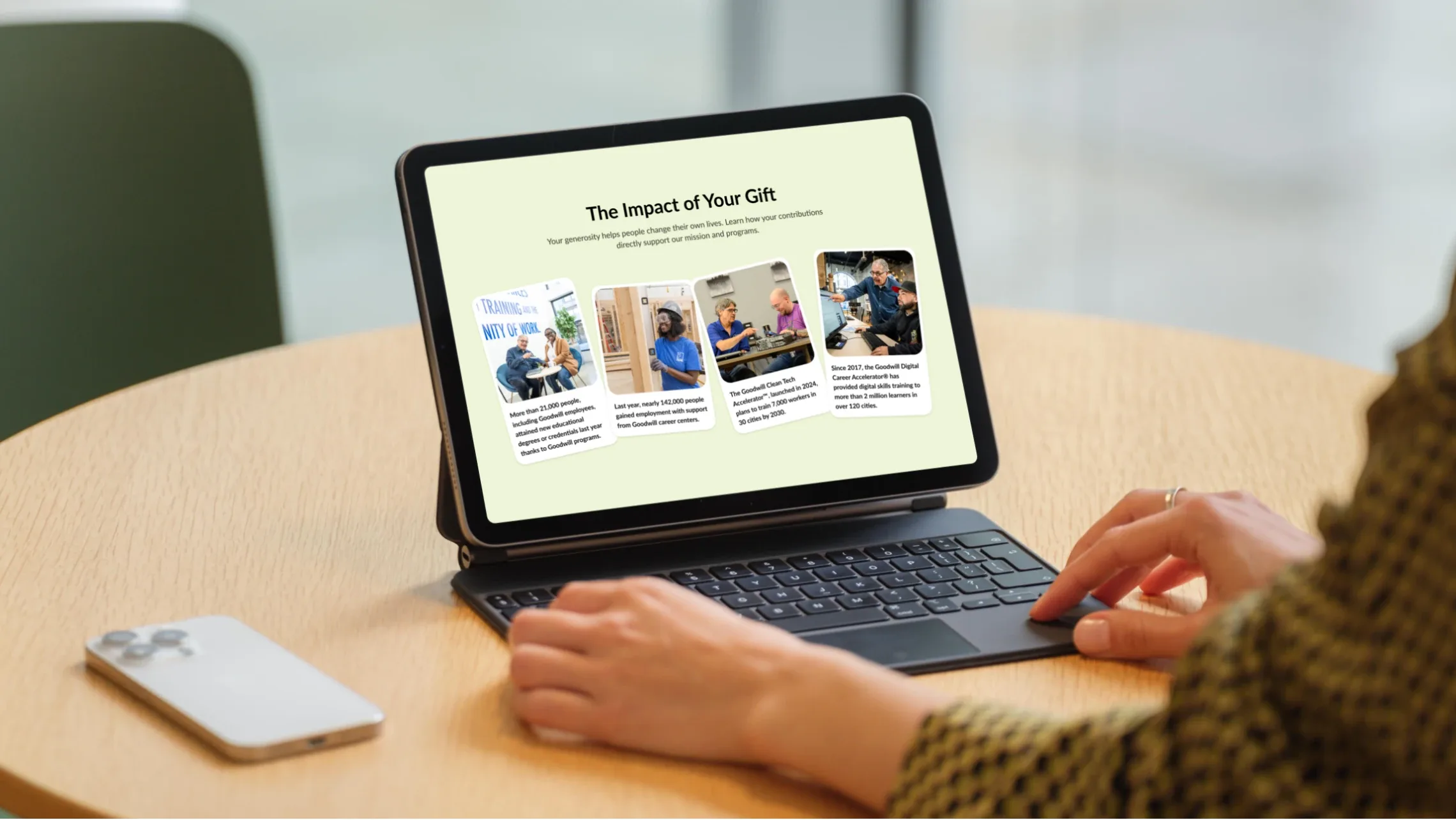Person browsing “The impact of your gift” on a tablet