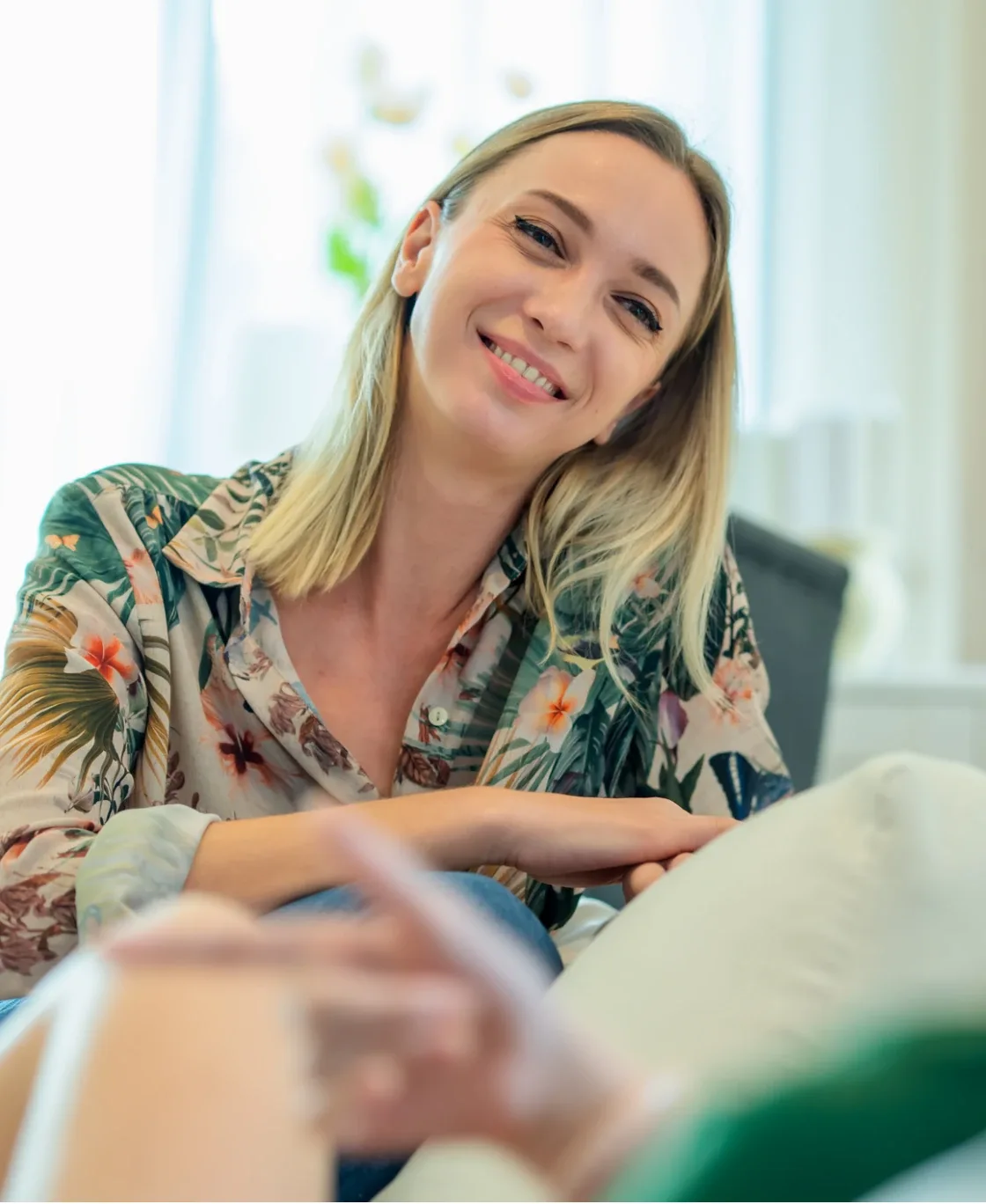 Smiling woman talking during a relaxed conversation
