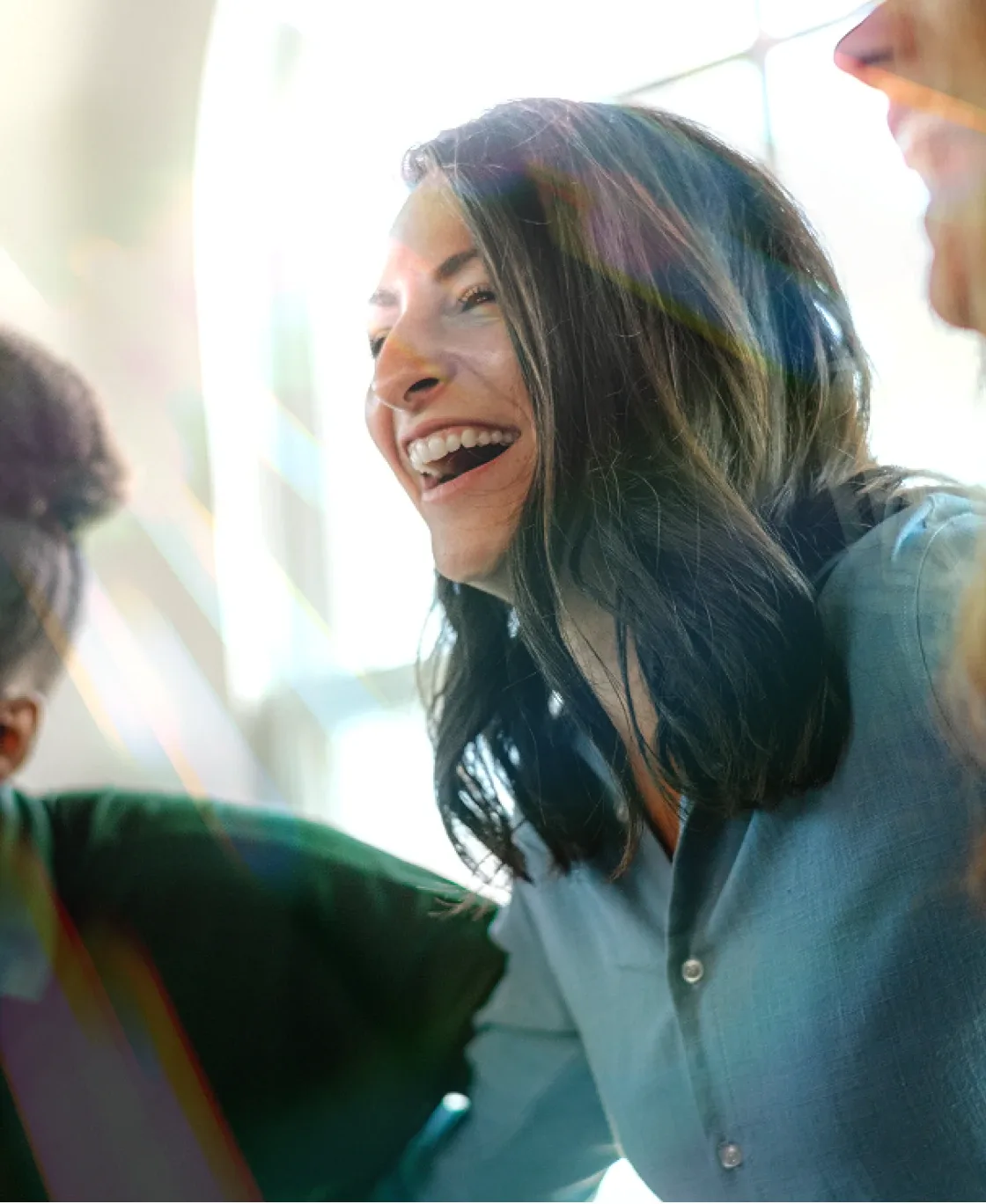 Woman laughing during a conversation