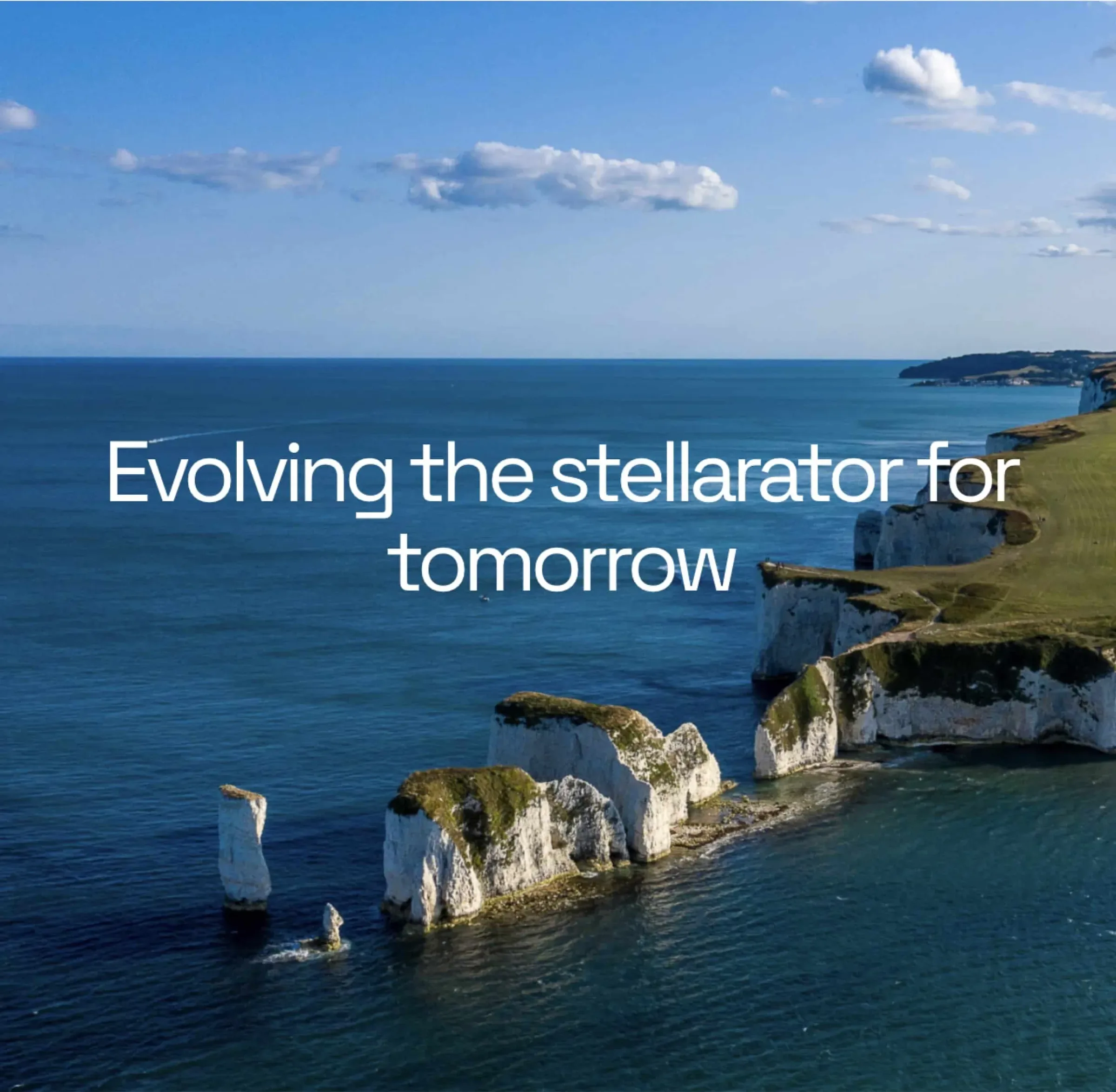 Coastal cliffs and blue sea under a cloudy sky with text: "Evolving the stellarator for tomorrow."