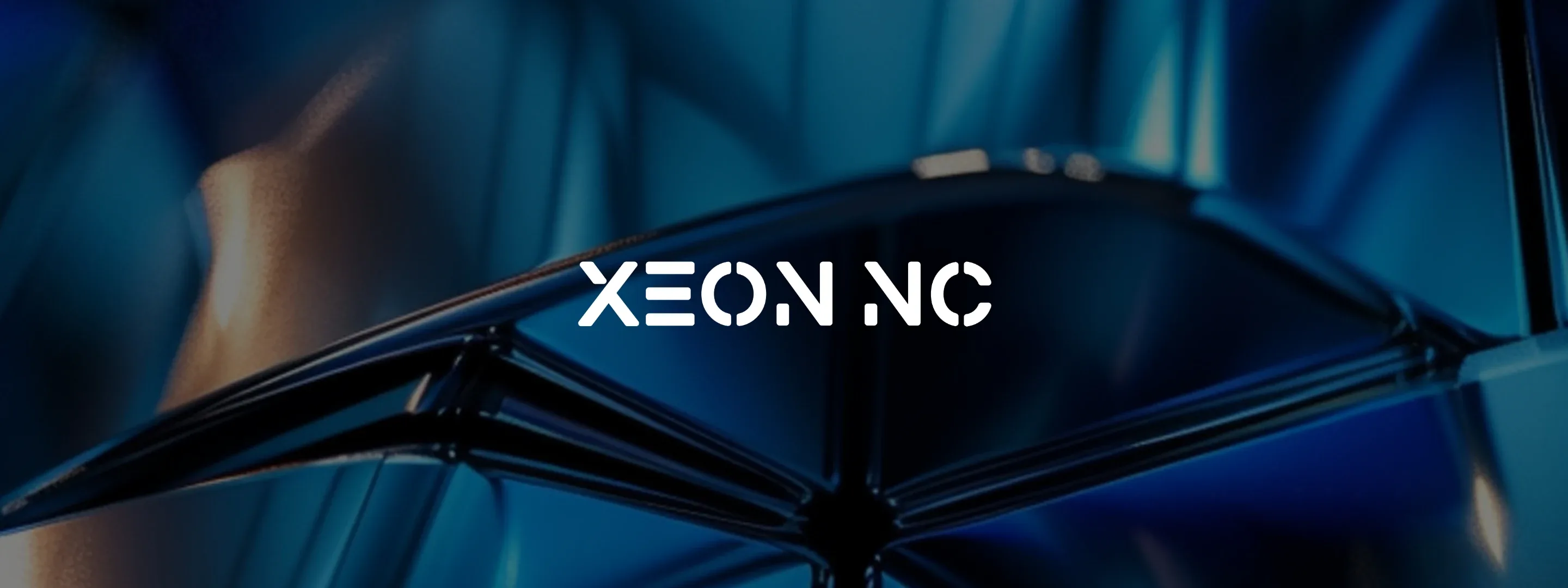 Xeon NC logo over a close-up of blue machined metal